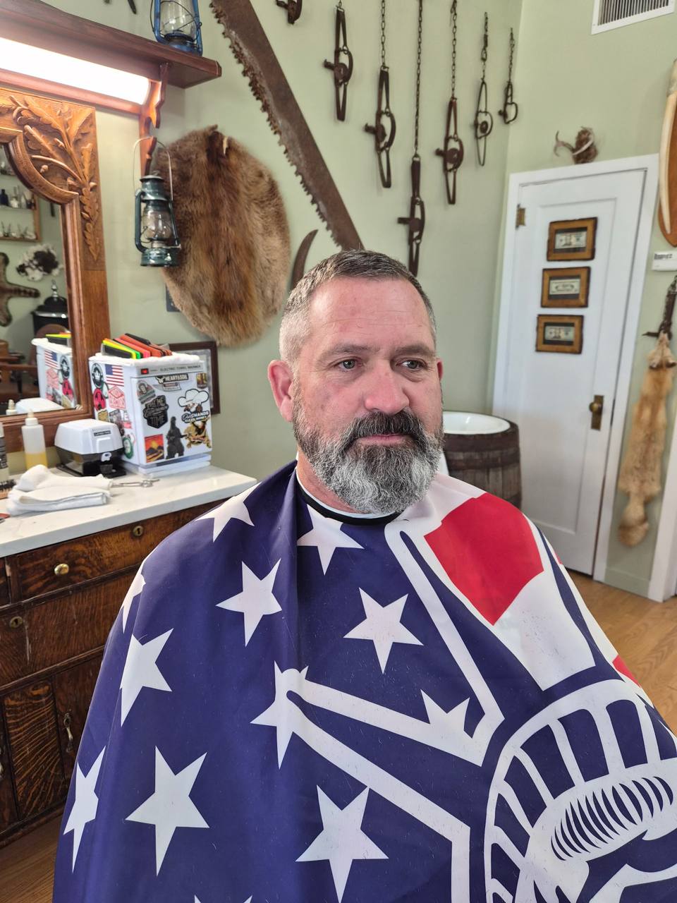 Tony Anderson in traditional American flag barber cape