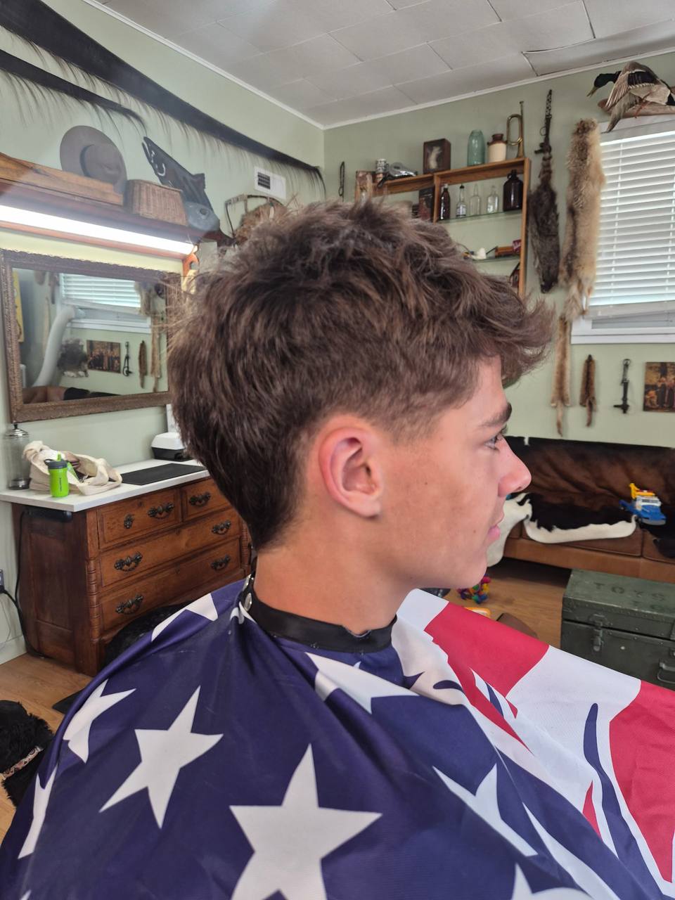 Side profile of teenage client after haircut
